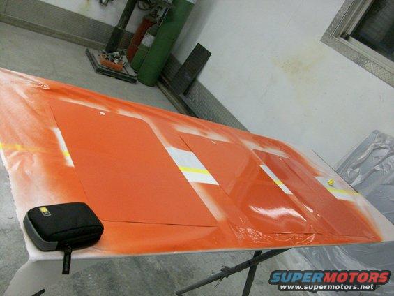 100_0183.jpg We sprayed out six different paint samples, to see what it might really look like on the car:

orange base coat with clear,          
orange base coat with silver pearl midcoat and clear,     
orange base coat with white pearl midcoat and clear, 
orange base coat with gold pearl-in-binder flames and clear,
orange base coat with silver pearl midcoat and gold pearl-in-binder flames,
orange base coat with white pearl midcoat and gold pearl flames.