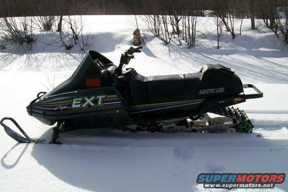 1990 Arctic Cat El Tigre EXT snowmobile parked in the snow