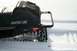 1990 Arctic Cat El Tigre EXT - This Arctic Cat snowmobile has a torn seat and is parked in a snowy area.