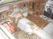 1970 Ford Mustang - The interior of this vehicle shows significant rust damage and a pile of electrical wires on the floor.