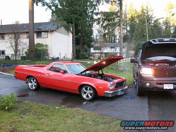 100_0307.jpg off to a lousy start; dead battery slows me down moving the car to the body shop; I think I left the interior lights on...