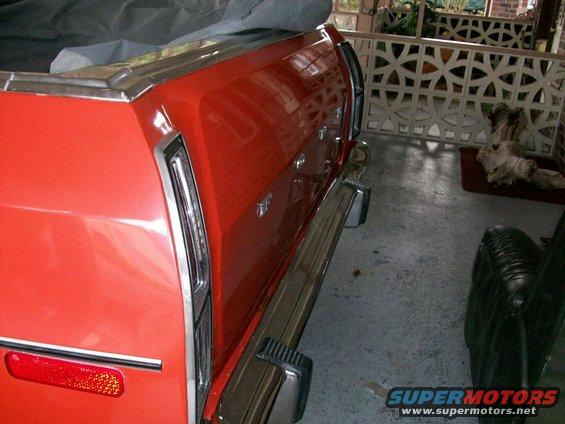 100_0295.jpg I got rear-ended this summer, by an Escalade, so the tailgate has a dent