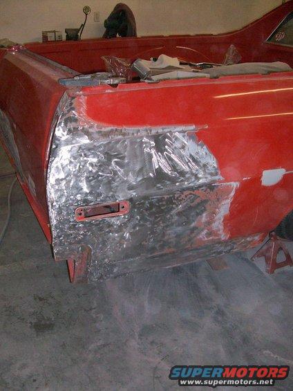 100_0344.jpg We've ground off all the paint and bondo, so we can properly fix the dent; there was about 3/8" of bondo on this panel, for no reason.