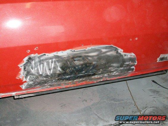 100_0352.jpg We used a dent puller to straighten out the tailgate, and then welded up the holes.