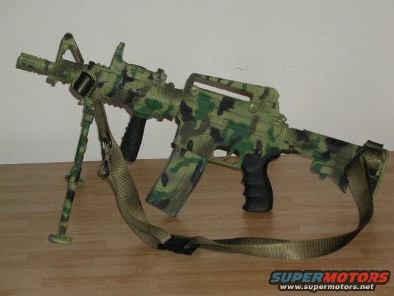 toy assault rifle with camouflage pattern and bipod