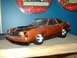 1978 Ford Mustang II - Toy car model of a 1977 Ford Mustang II displayed with its packaging.