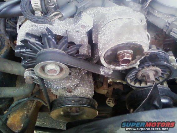 Engine belt and pulleys with corrosion. Water pump pulley visible