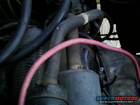 Engine hoses and starter motor with red cable