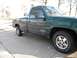1995 GMC Sierra 1500 - Side view of a green 1995 GMC Sierra 1500 pickup truck.