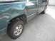 1995 GMC Sierra 1500 - This 1995 GMC Sierra 1500 pickup truck shows extensive damage to its rear quarter panel.