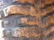 1995 Ford Bronco - This is a close-up view of a tire tread with mud caked in the grooves.