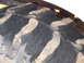 1995 Ford Bronco - Aggressive tread pattern visible on a large tractor tire, likely for off-road use.