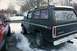 1979 Ford Bronco - Black 1978 Ford Bronco with roof rack and trailer hitch, parked next to a red SUV.