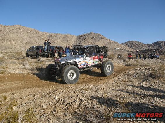 Off-road buggy with number 024 on desert trail