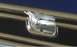 1979 Ford F-250 - A chrome emblem is shown on the horizontal bars of a vehicle's grille, with a SuperMotors logo in the corner.