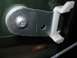 2003 Ford Crown Victoria - Close-up of a door window regulator mechanism, showing a white plastic clip attached to a metal bracket.