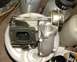1999 Kawasaki H2C - Close-up of a turbocharger wastegate assembly, likely a performance part.