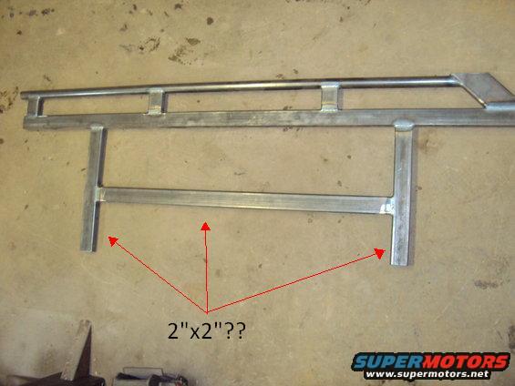 Metal tubing assembly with red arrows pointing to "2"x2"??" text