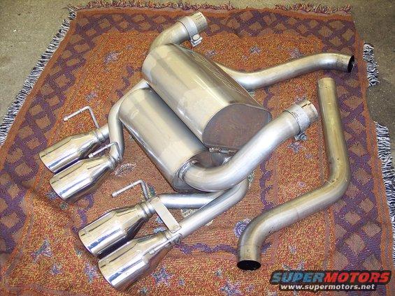Exhaust system with quad tips and dual mufflers on a patterned rug