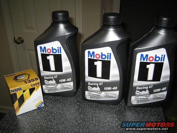 Three bottles of Mobil 1 Racing 4T 10W-40 oil and one NAPA Gold 1359 oil filter