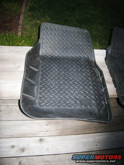 Black rubber floor mat with diamond tread pattern