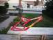 1986 Ford Bronco - A red bicycle frame with "INTENSE" branding sits on a wooden table outdoors.