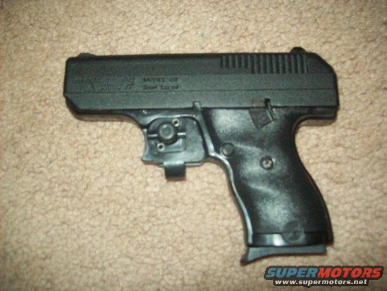 Black handgun with visible text on slide
