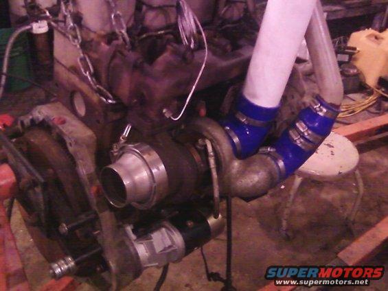 turboplumbing4.jpg The HE341 plumbed in: the tall PVC is a temporary place holder for finding clearances for the final intake pipe.