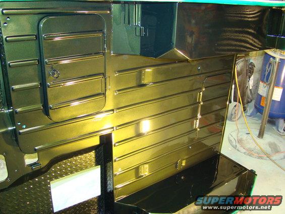 Interior of vehicle with ribbed panels and a storage compartment, gold finish