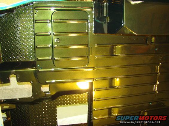 Green metallic painted interior panels with diamond plate accents and horizontal ribbing
