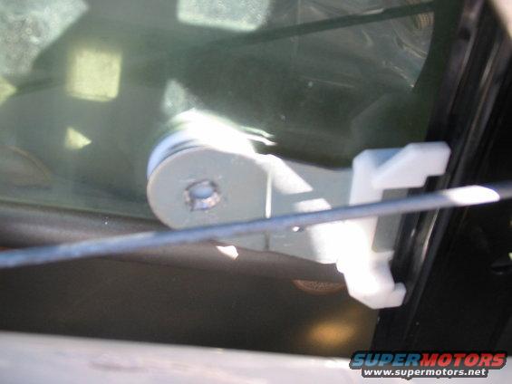 Door latch mechanism inside a car door, viewed from interior