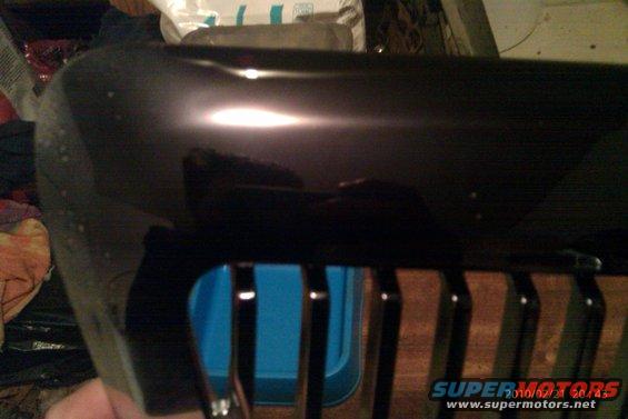 Black grille with vertical bars