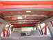 1992 Ford Explorer - The interior ceiling of a vehicle is visible, showing exposed metal supports and wiring.