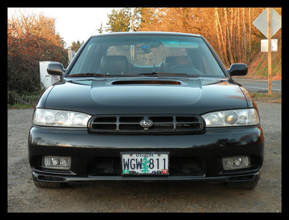 Front view of a black 1998 Subaru Legacy sedan with Oregon plates WGW 811