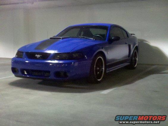 Blue coupe with black racing stripes, 3/4 front view