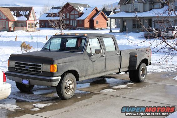 Gray crew cab dually pickup truck, 3q-front view