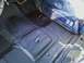 1994 Ford F-250 - The interior floor of a vehicle shows signs of rust and a black coating.