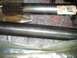 1994 Ford Bronco - Close-up of two axle shafts, one labeled YAW 38816 and the other with PVS-G1P stamped on it.