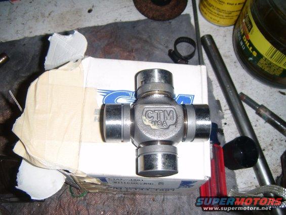 CTM USA universal joint on a box, next to tools and a jar