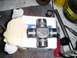 1994 Ford Bronco - A CTM USA universal joint is shown on its box, surrounded by various tools and a jar of liquid.
