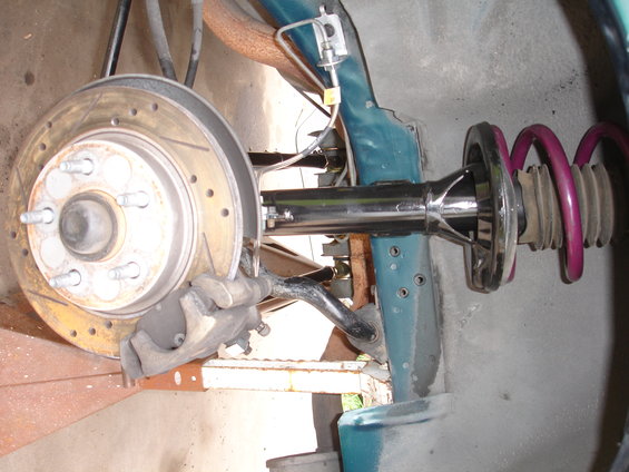 Car suspension part with brake rotor and caliper