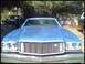 1973 Ford Ranchero - 1974 Ford Ranchero GT front end, parked outdoors with trees in the background.