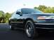 1996 Ford Crown Victoria - Front quarter view of a black 1996 Ford Crown Victoria parked on asphalt.