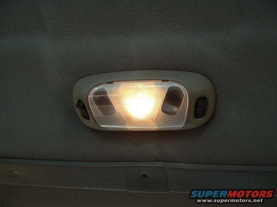 domelight.jpg Great little upgrade for bling bling.  Actually it cost 13 bucks brand new from e-bay, came from an f-250 superduty, and the wiring is the EXACT same for m 94.  Much brighter and much nicer looking.