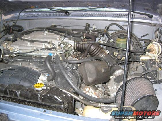 Engine bay of a 1990 Toyota Pickup/SR5, showing the V6 engine and air intake