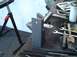 1993 Ford Bronco - A metal bracket is shown on a workbench with various tools and a spray can nearby.