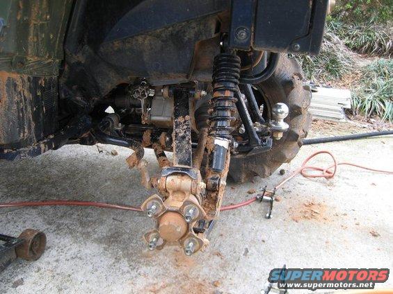 ATV suspension and wheel hub with a tow hitch ball