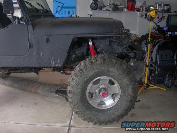 1991 Jeep Wrangler front fender, wheel, and suspension components