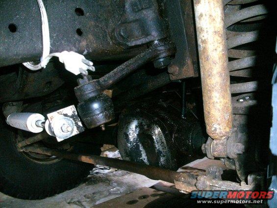 Undercarriage steering linkage and shock absorber