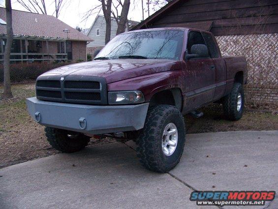 Maroon pickup truck with custom bumper and lift kit, 2001 Dodge 1500